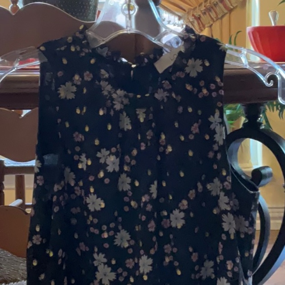 Sleeveless floral blouse peplum bottom